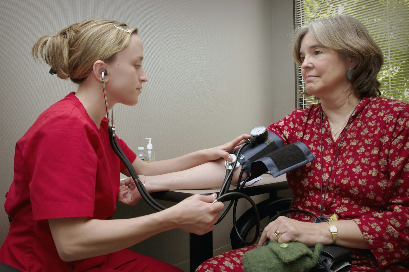 Nurse measuring a patient's blood pressure